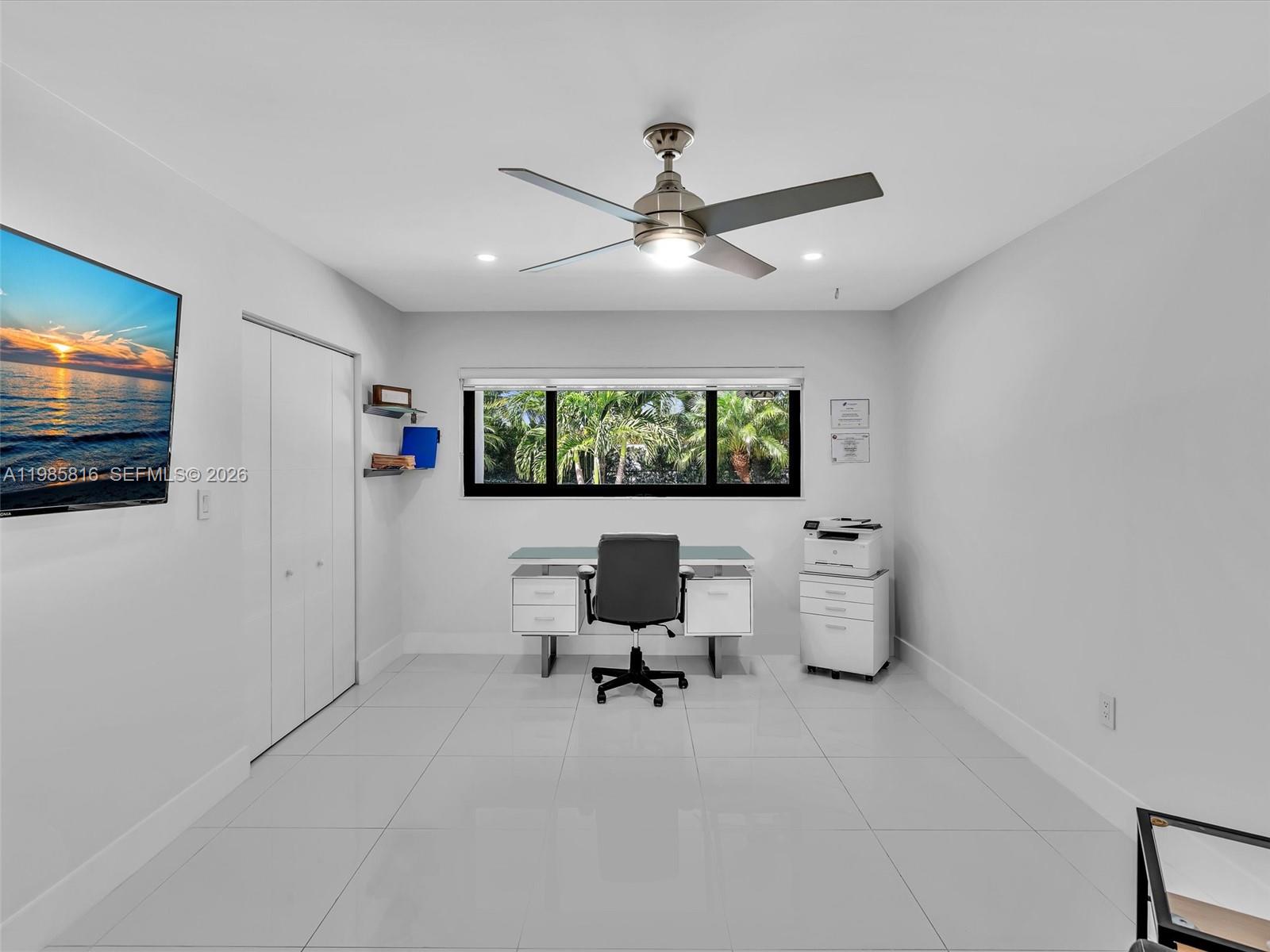 4501 Southwest 133rd Avenue Southwest Ranches, FL 33330 - Photo 50 of 100 a view of a livingroom with furniture and a flat screen tv