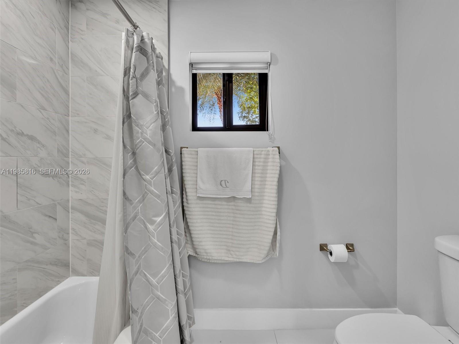 4501 Southwest 133rd Avenue Southwest Ranches, FL 33330 - Photo 53 of 100 a bathroom with a toilet and a shower