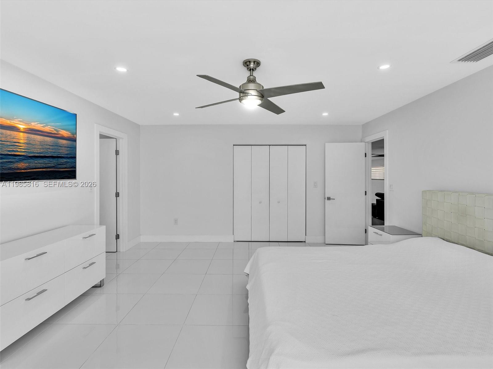4501 Southwest 133rd Avenue Southwest Ranches, FL 33330 - Photo 59 of 100 a bedroom with a bed and a flat screen tv