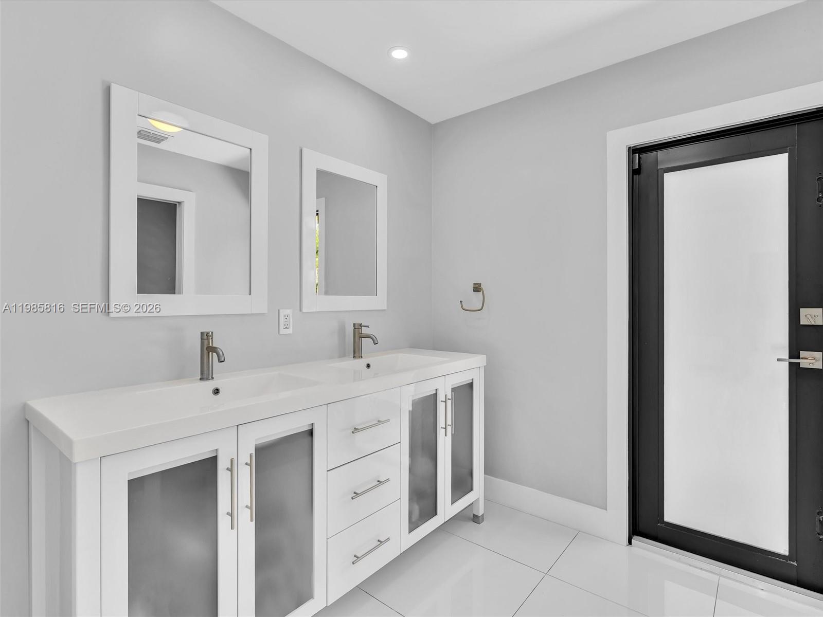 4501 Southwest 133rd Avenue Southwest Ranches, FL 33330 - Photo 62 of 100 a spacious bathroom with a double vanity sink and mirror