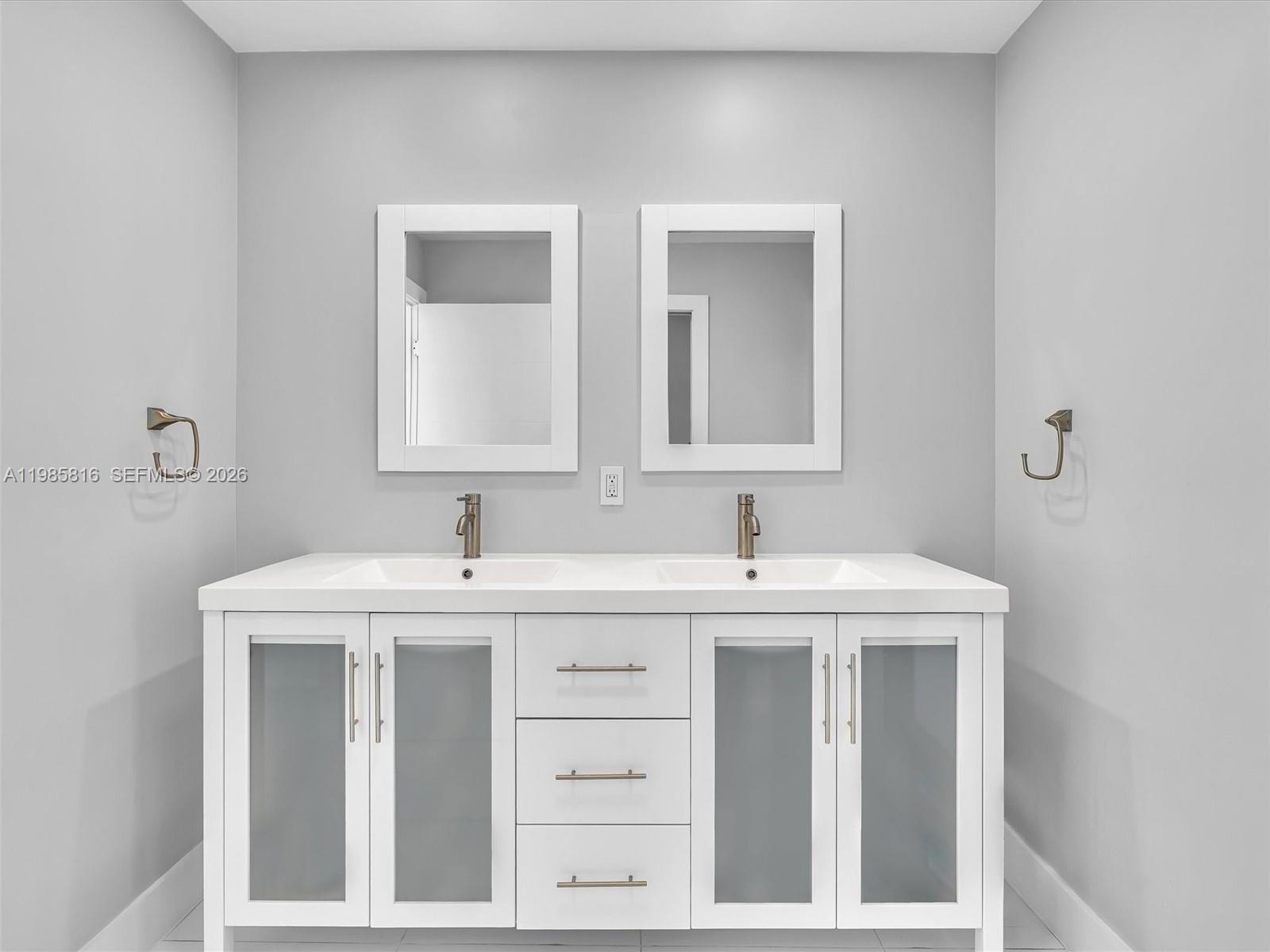 4501 Southwest 133rd Avenue Southwest Ranches, FL 33330 - Photo 63 of 100 a bathroom with a sink and a mirror