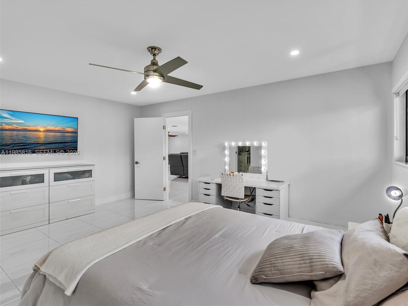 4501 Southwest 133rd Avenue Southwest Ranches, FL 33330 - Photo 66 of 100 a bedroom with a bed and a tv