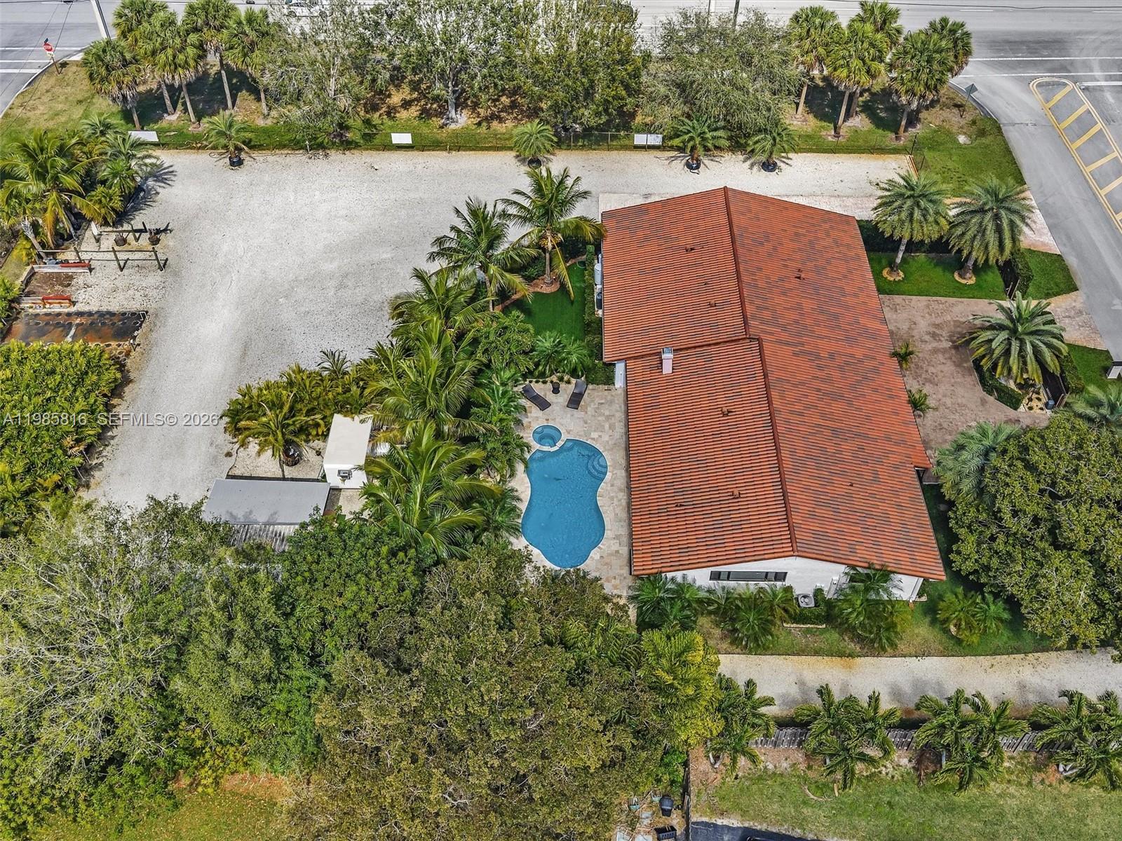 4501 Southwest 133rd Avenue Southwest Ranches, FL 33330 - Photo 7 of 100 an aerial view of a house with a garden and yard