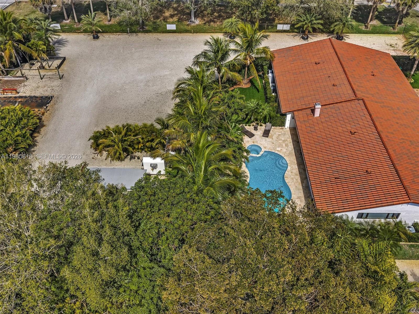 4501 Southwest 133rd Avenue Southwest Ranches, FL 33330 - Photo 8 of 100 an aerial view of a house with a yard and lake view