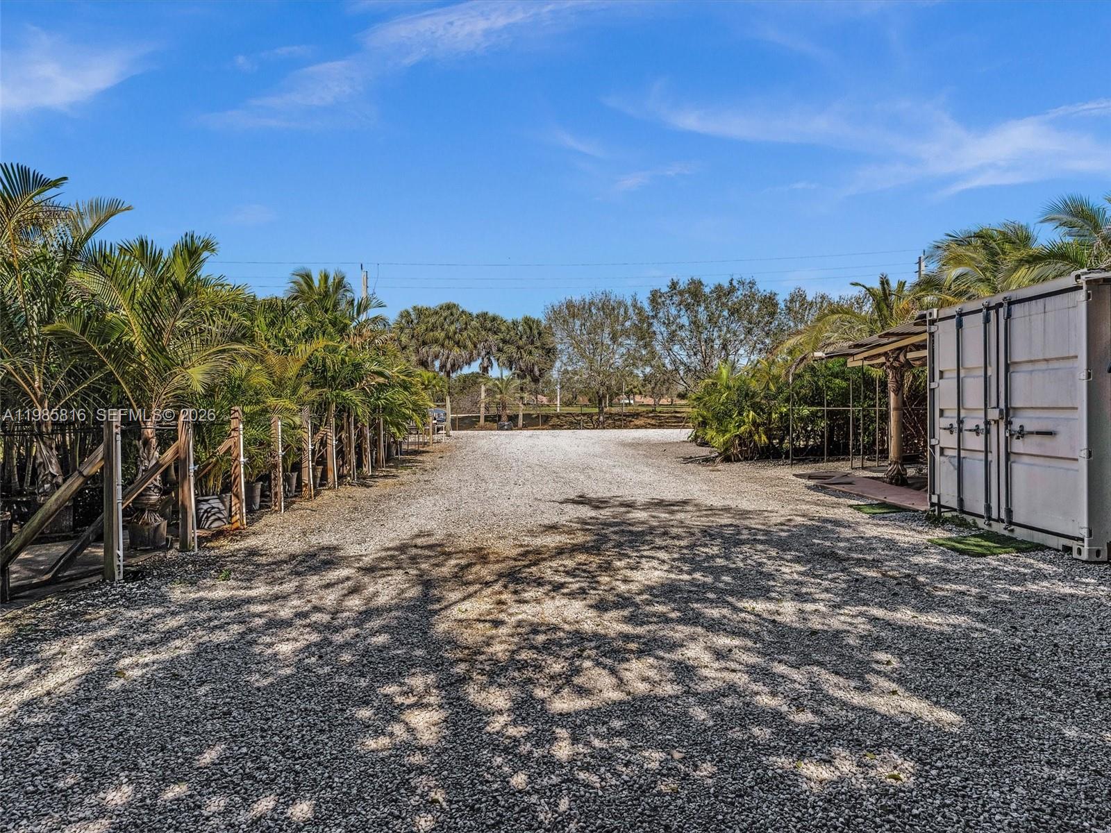 4501 Southwest 133rd Avenue Southwest Ranches, FL 33330 - Photo 85 of 100 a view of a yard with wooden fence