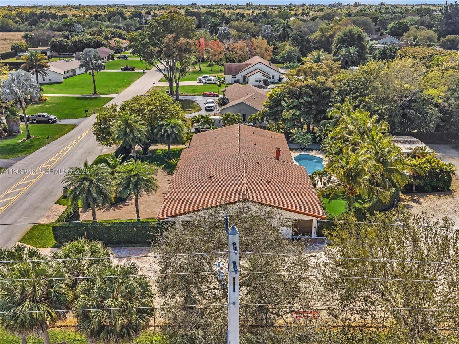 4501 Southwest 133rd Avenue Southwest Ranches, FL 33330 - Photo 94 of 100 an aerial view of a house with a yard and lake view in back