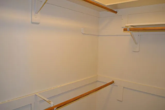 a view of a room with racks on the wall