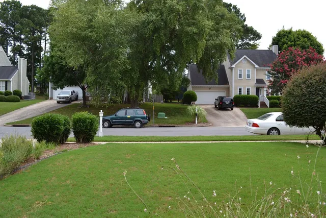 a view of a house with a yard porch and sitting area