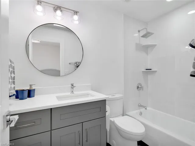 a row of palm trees and swimming pool in the backyard of a house