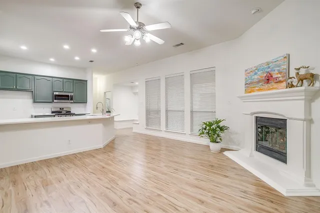 a living room with furniture and a fireplace