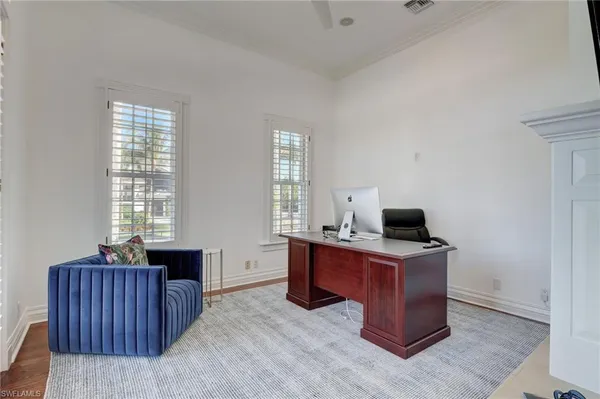 a large white kitchen with a large window