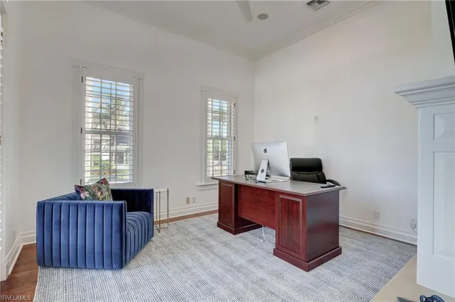 a large white kitchen with a large window
