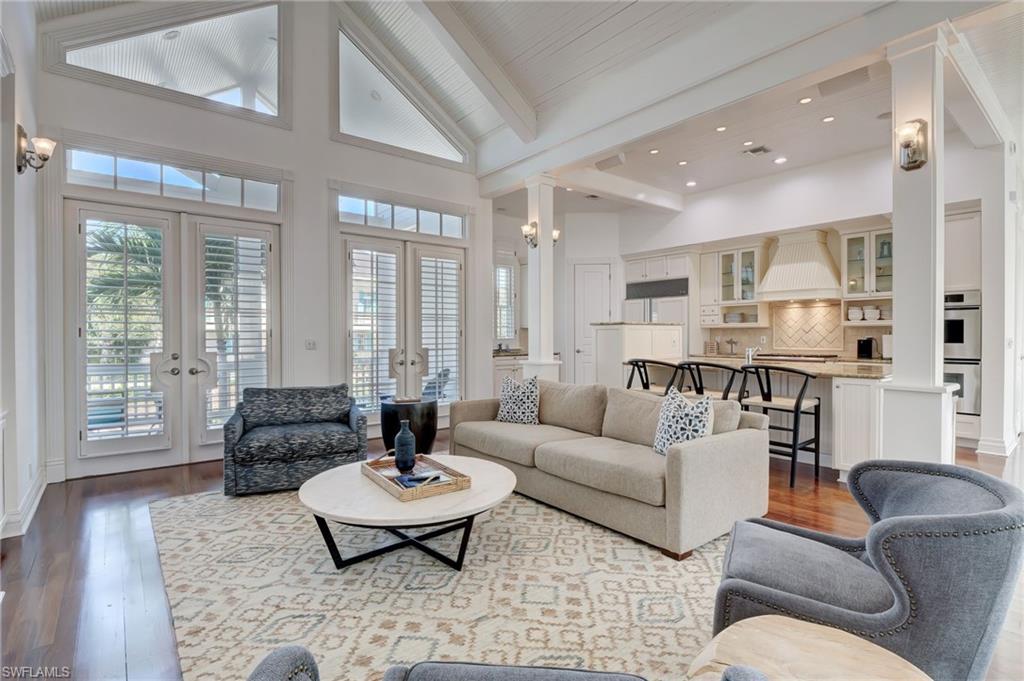 1551 Gulf Shore Boulevard South Naples, FL 34102 - Photo 17 of 44 a living room with furniture and floor to ceiling windows