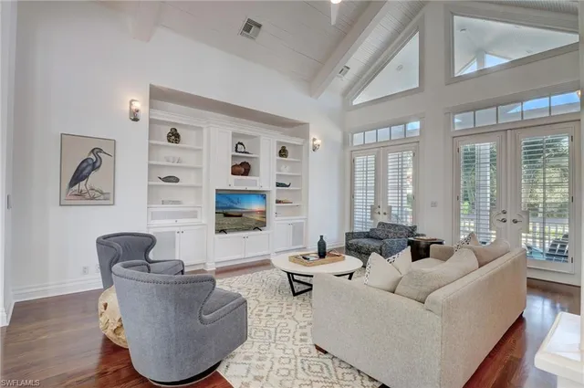 a living room with furniture and a lamp