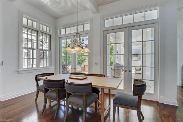 a kitchen with sink cabinets and wooden floor