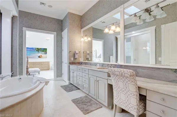a bathroom with a tub and shower