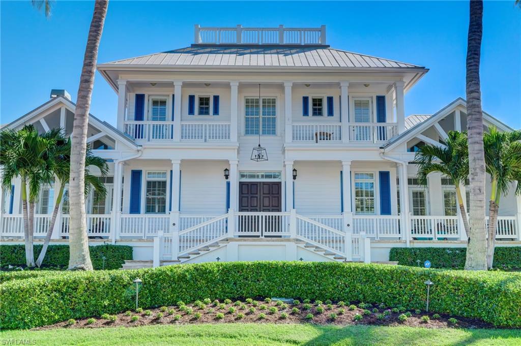 1551 Gulf Shore Boulevard South Naples, FL 34102 - Photo 3 of 44 a front view of a house with a yard