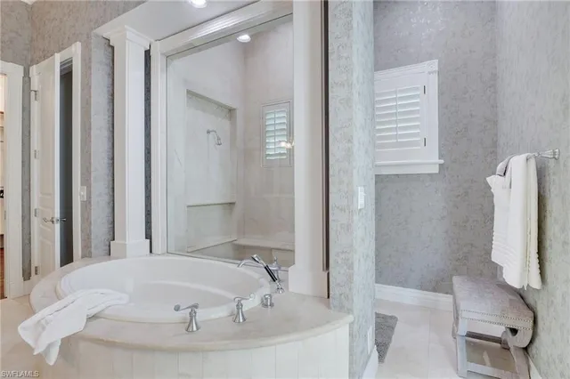 a bedroom with double bed and a wooden floor