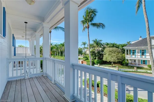 a view of a balcony with furniture