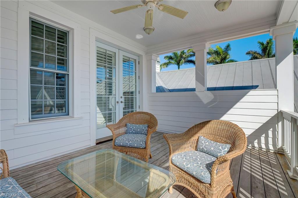 1551 Gulf Shore Boulevard South Naples, FL 34102 - Photo 36 of 44 an outdoor living area with furniture and a potted plant