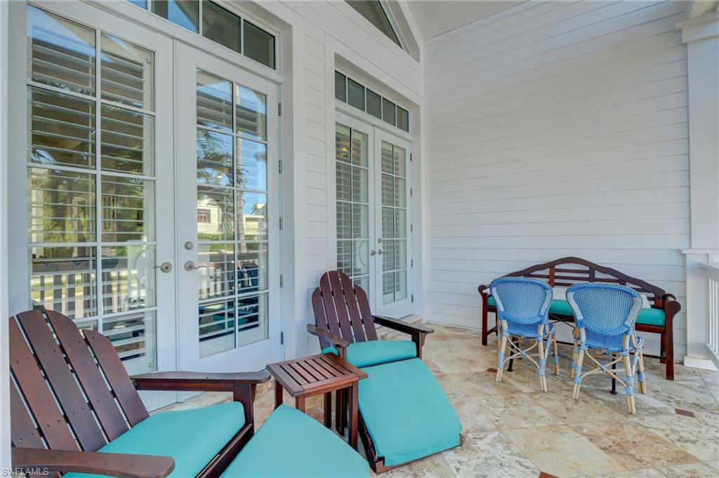1551 Gulf Shore Boulevard South Naples, FL 34102 - Photo 4 of 44 a living room with furniture and a window