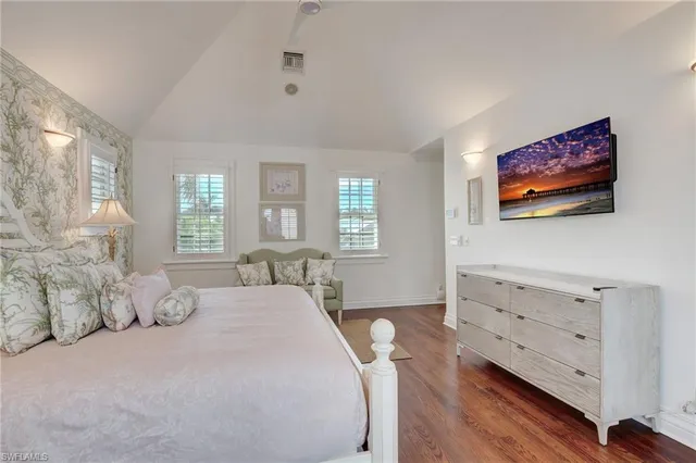 a bathroom with a granite countertop sink a mirror and a shower