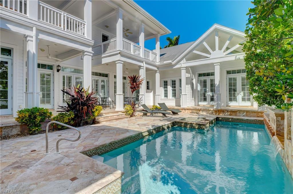1551 Gulf Shore Boulevard South Naples, FL 34102 - Photo 44 of 44 a view of a house with pool and chairs