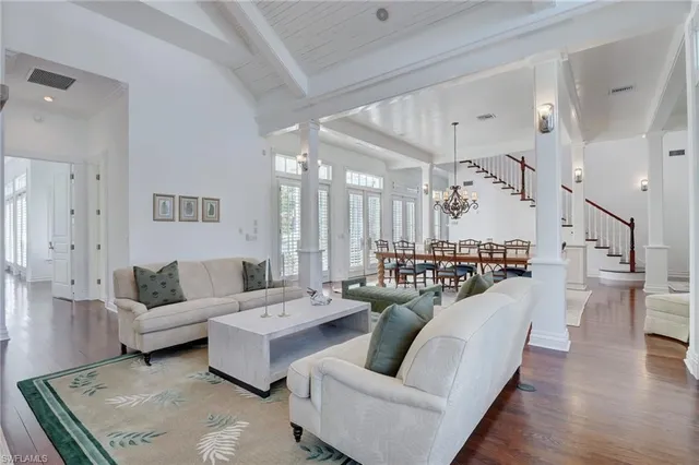 a view of workspace with wooden floor windows