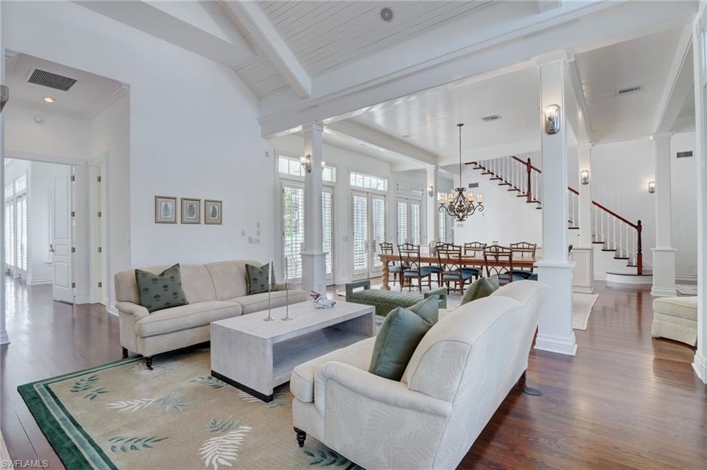 1551 Gulf Shore Boulevard South Naples, FL 34102 - Photo 10 of 44 a living room with furniture and a table