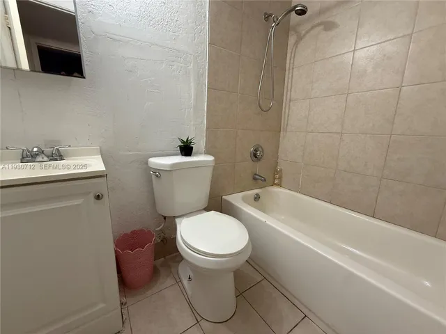 a bathroom with a toilet a sink and a bathtub