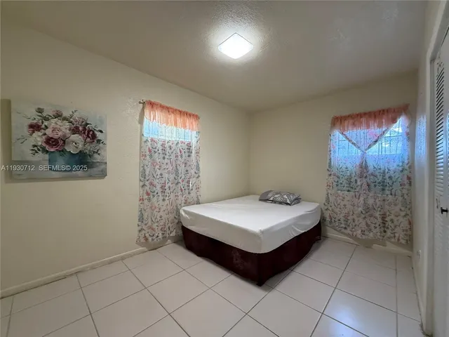 a room with a bed and a window