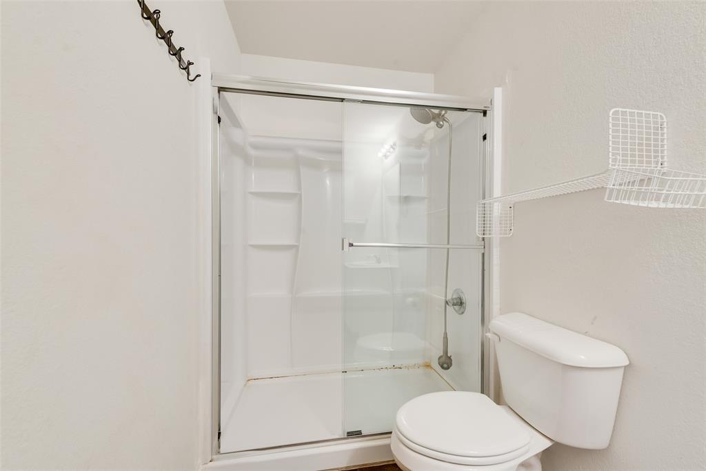3815 Spence Street Dallas, TX 75215 - Photo 7 of 15 a white toilet next to a bathroom