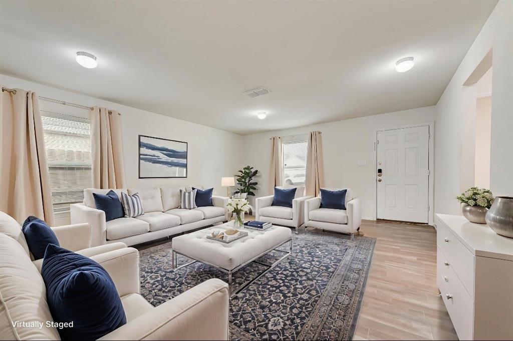 3815 Spence Street Dallas, TX 75215 - Photo 9 of 15 a living room with furniture and a couch