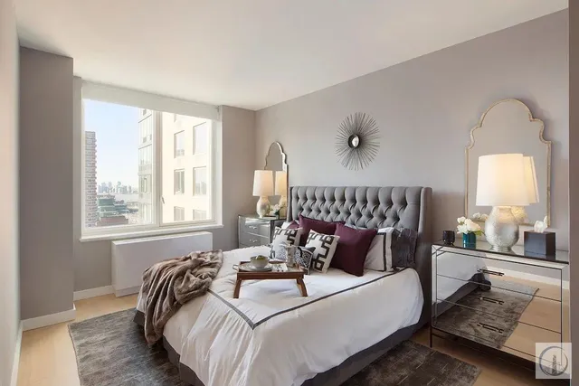 a bedroom with bed and window