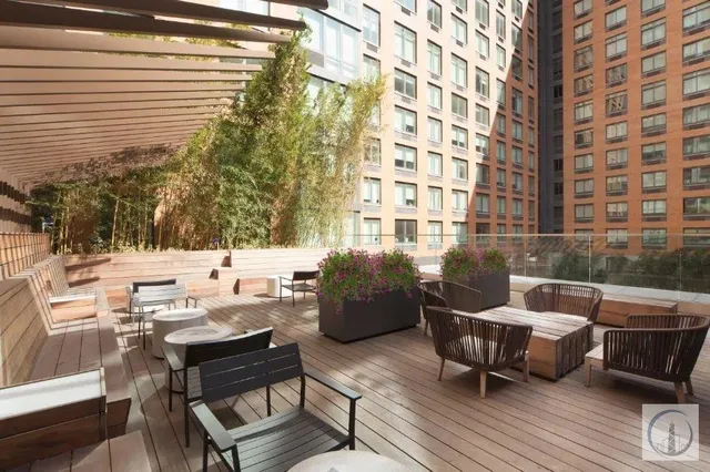 a view of a patio with couple of chairs and a couch