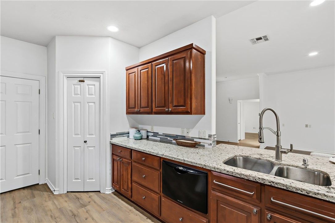 5310 Draycott Court Bryan, TX 77802 - Photo 19 of 31 a kitchen with a sink and cabinets