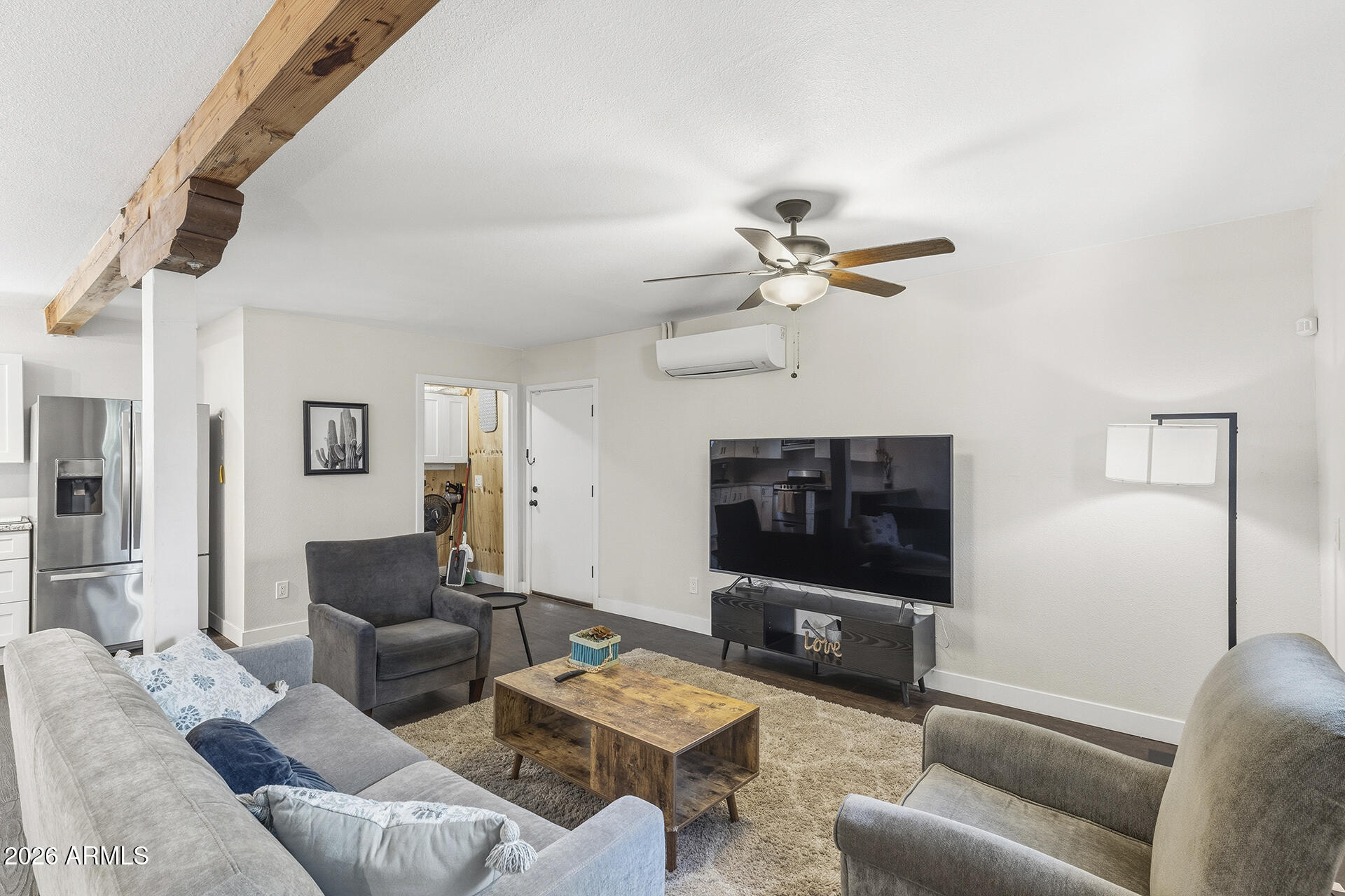 5228 North 15th Street Phoenix, AZ 85014 - Photo 81 of 96 a living room with furniture a ceiling fan and a flat screen tv