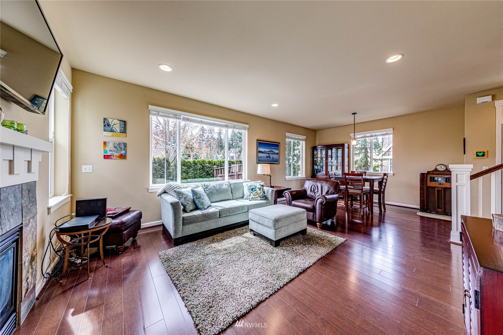 21821 38th Drive Southeast Bothell, WA 98021 - Photo 8 of 29 a living room with fireplace furniture and a flat screen tv