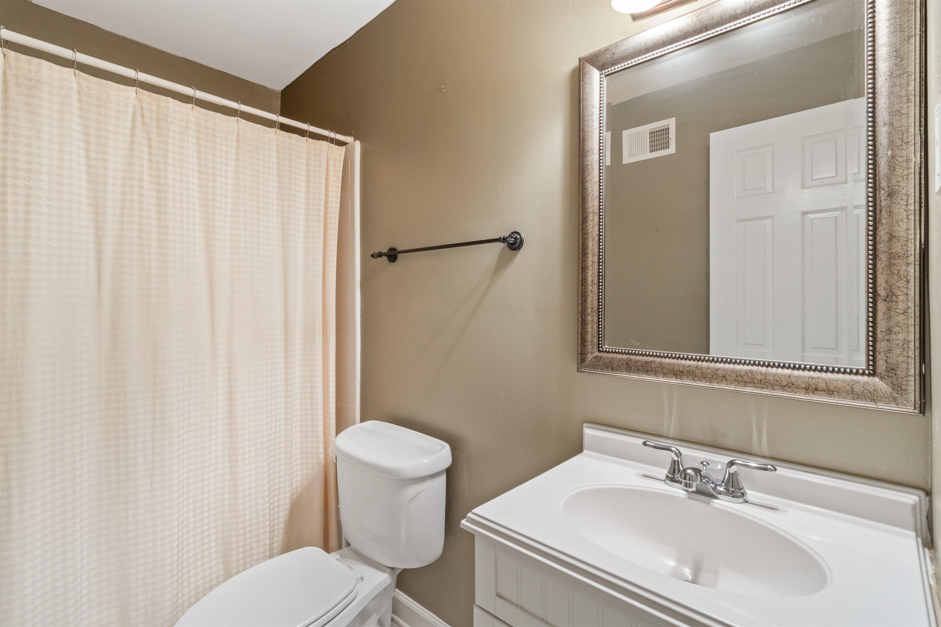 700 St Augustine Square, Unit D Memphis, TN 38104 - Photo 20 of 31 a bathroom with a sink toilet and shower
