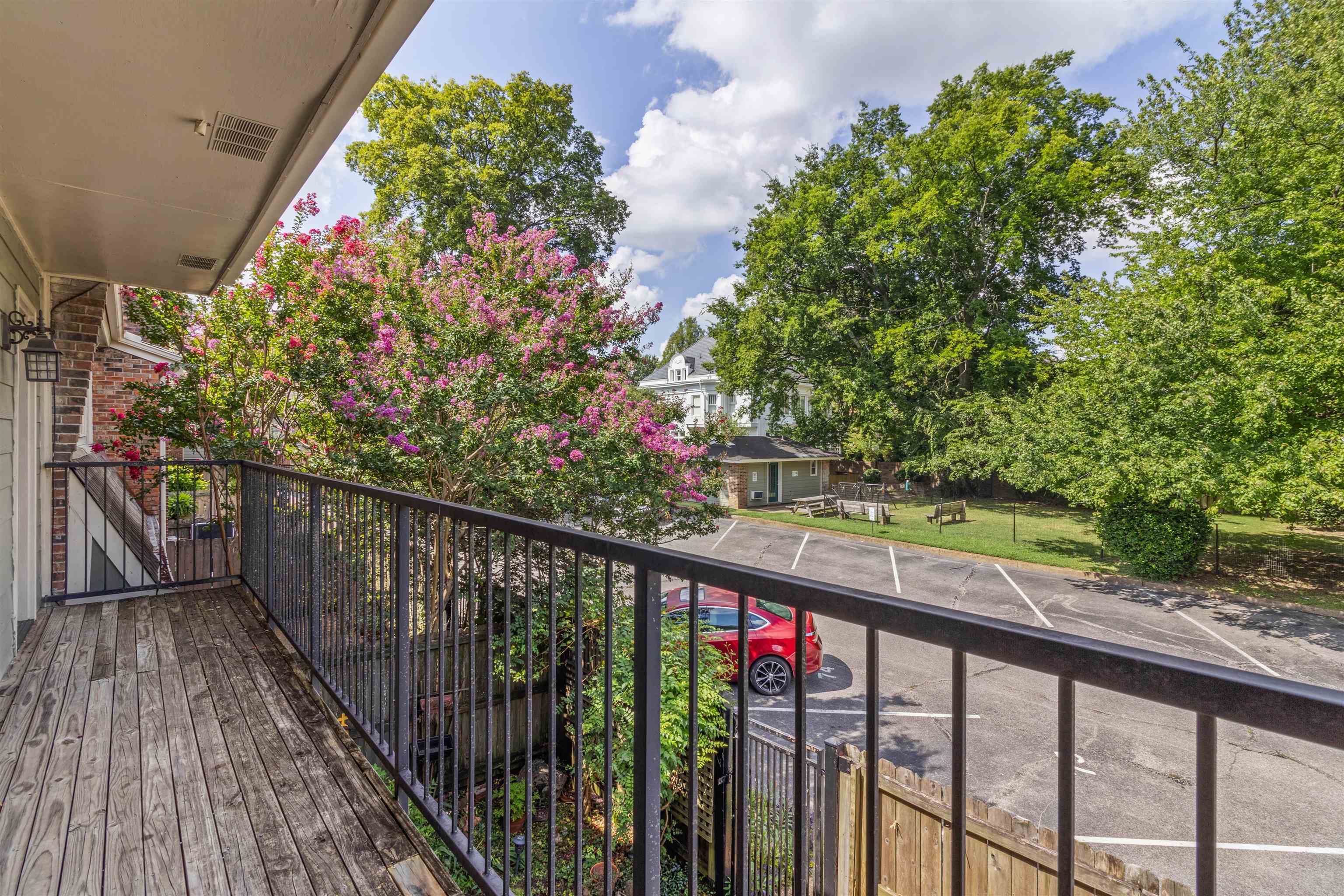 700 St Augustine Square, Unit D Memphis, TN 38104 - Photo 30 of 31 a view of a balcony with flower plants
