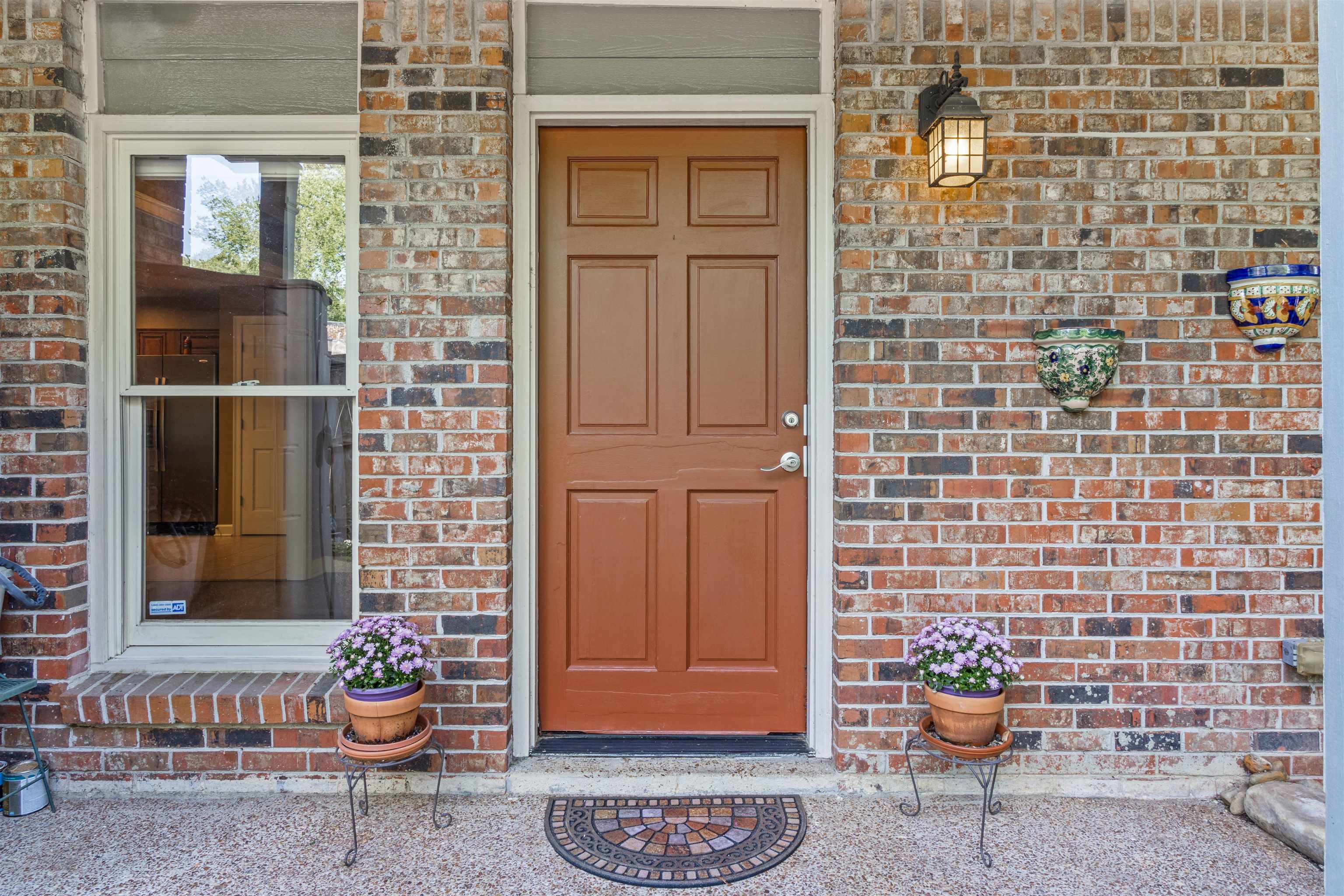 700 St Augustine Square, Unit D Memphis, TN 38104 - Photo 3 of 31 a view of a door and chair in the patio
