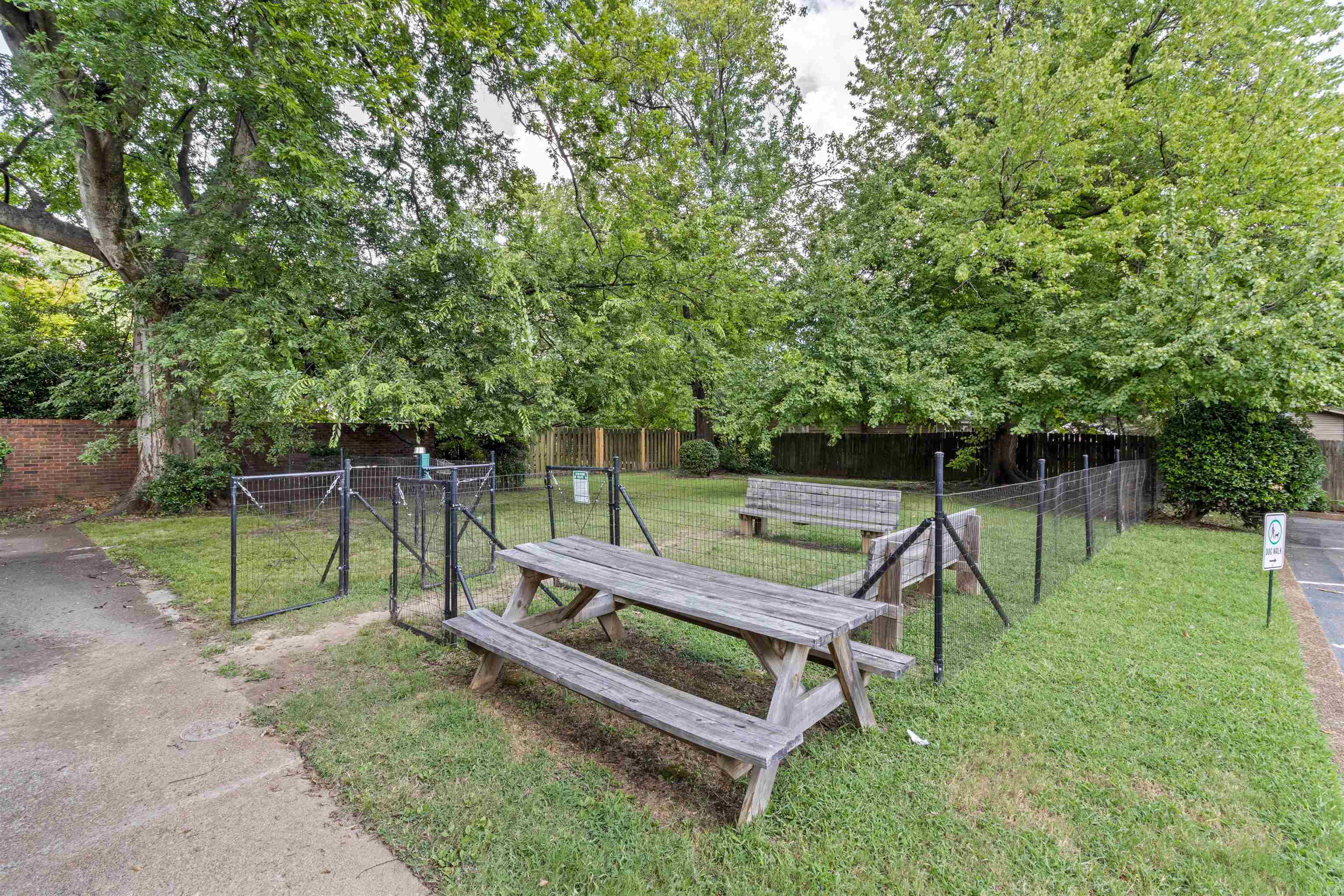 700 St Augustine Square, Unit D Memphis, TN 38104 - Photo 31 of 31 a park view with a bench in the park