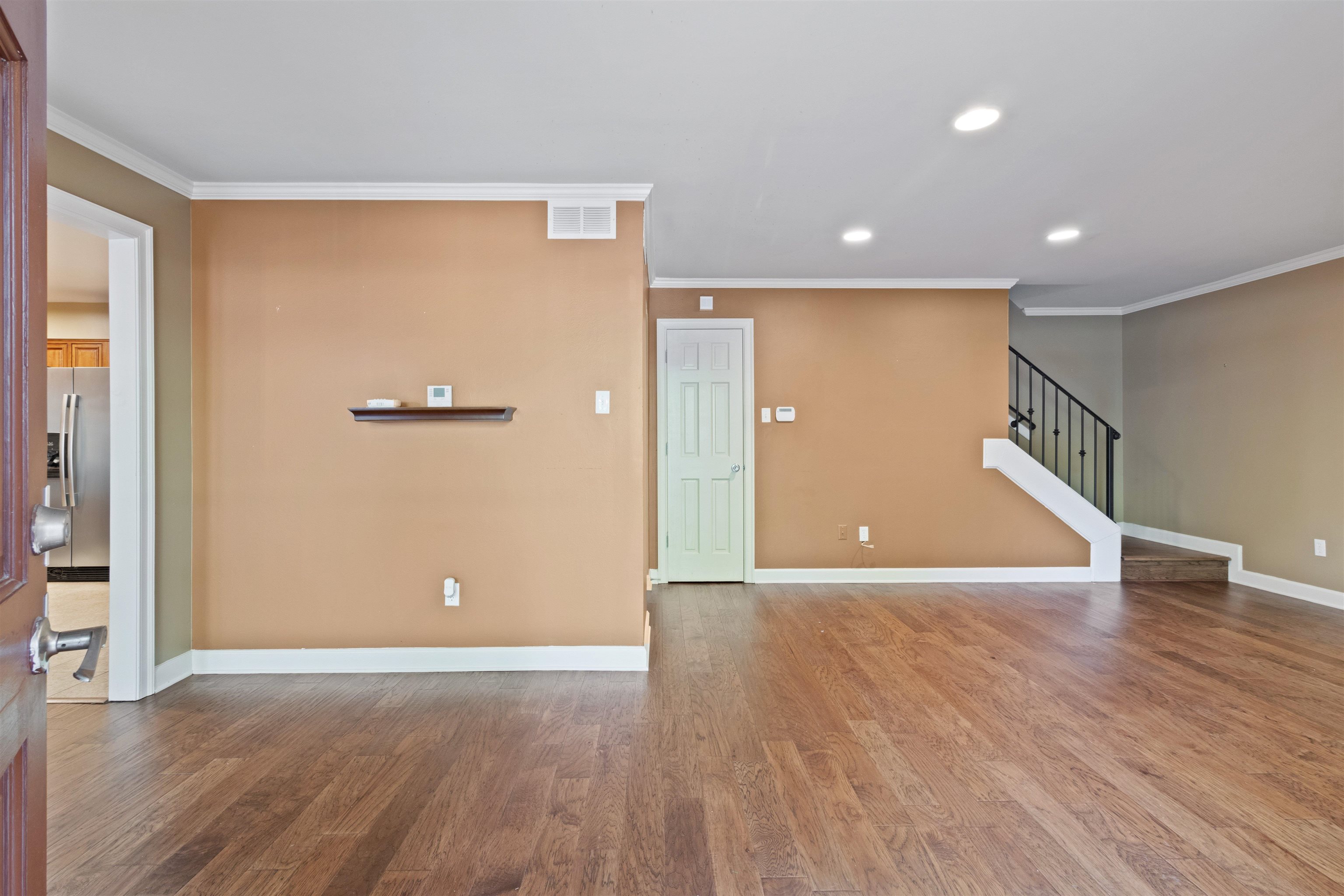 700 St Augustine Square, Unit D Memphis, TN 38104 - Photo 6 of 31 a view of an empty room with wooden floor