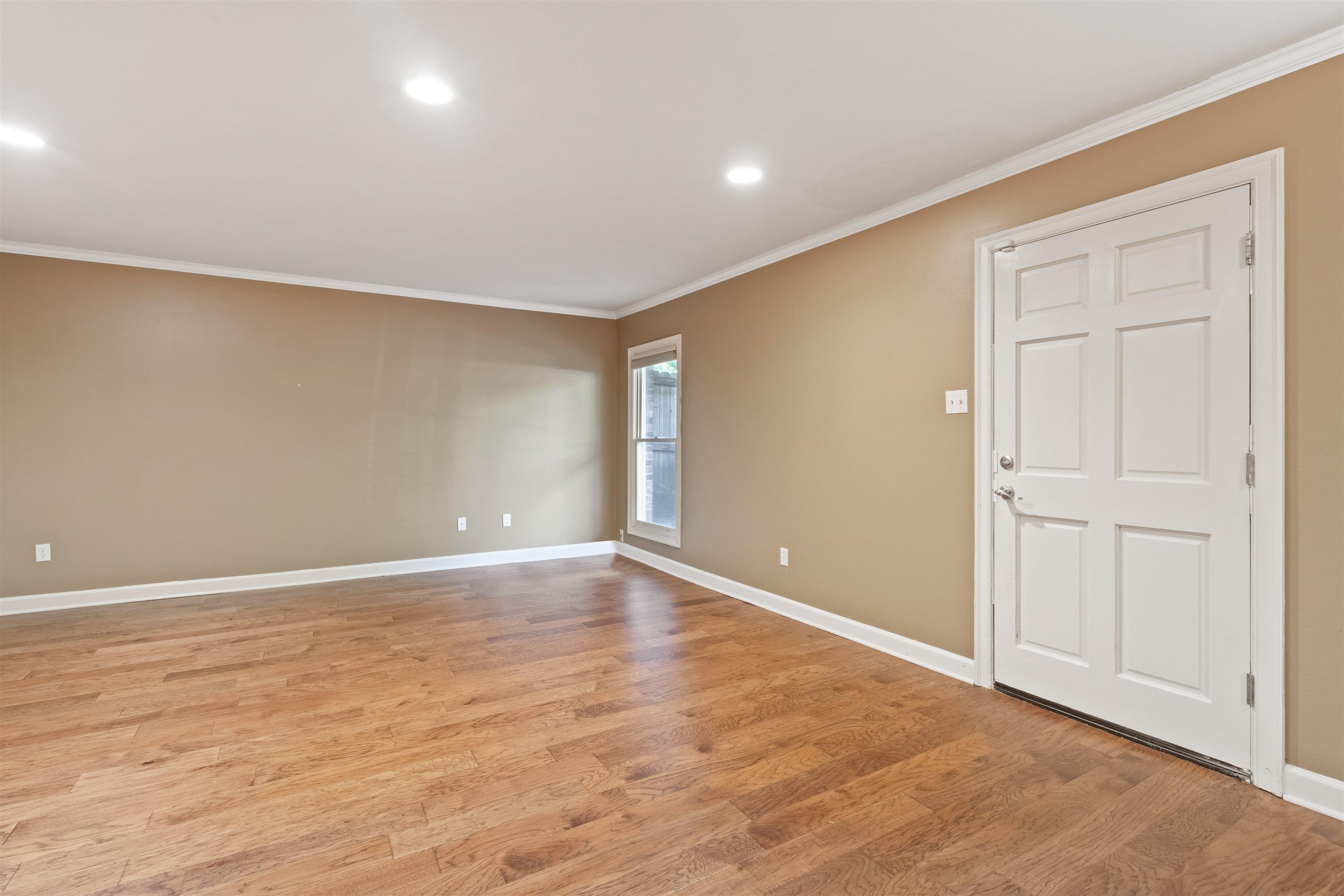 700 St Augustine Square, Unit D Memphis, TN 38104 - Photo 7 of 31 a view of an empty room with wooden floor