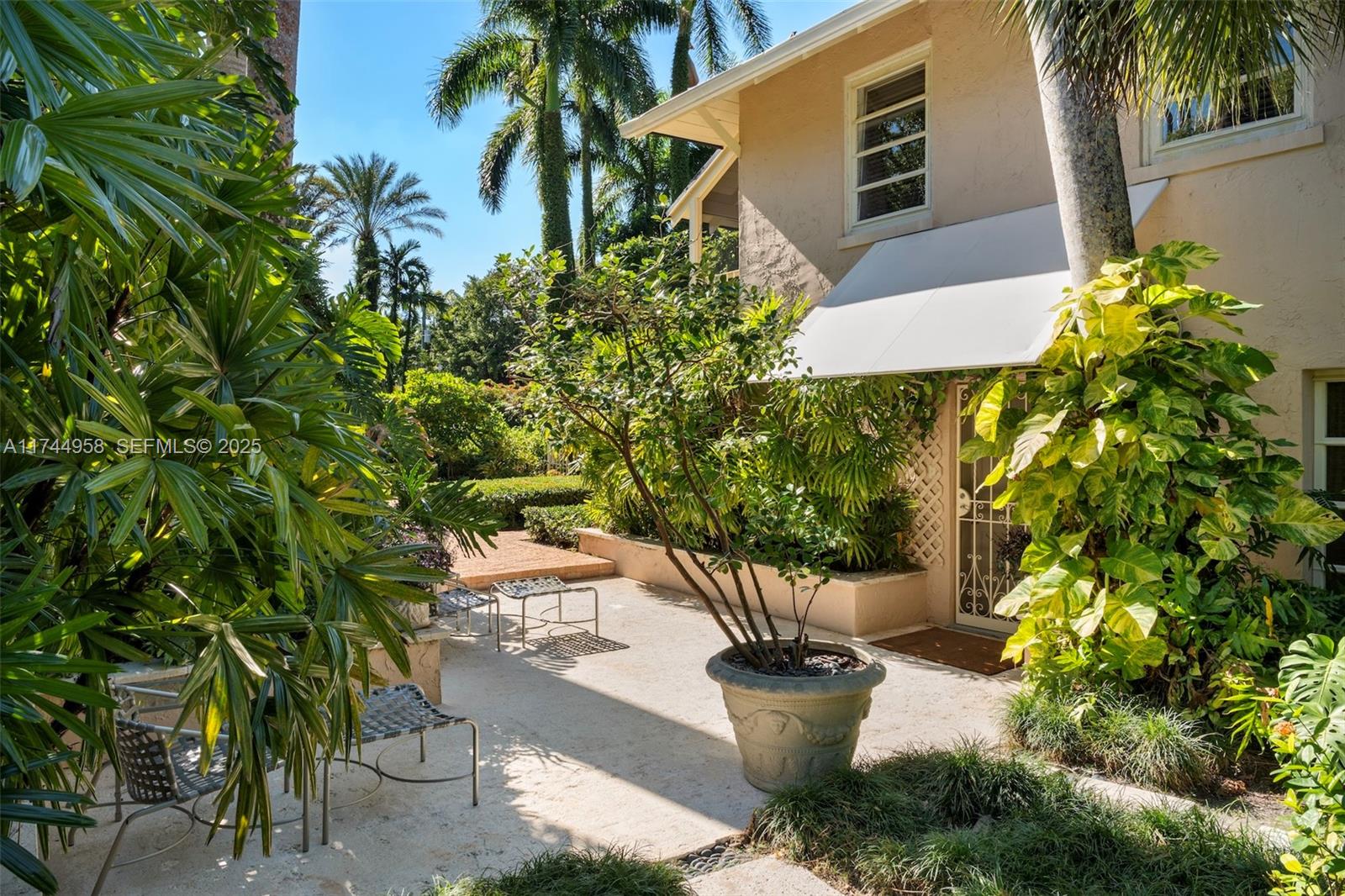 4197 Douglas Road Miami, FL 33133 - Photo 29 of 42 a view of a backyard with sitting area