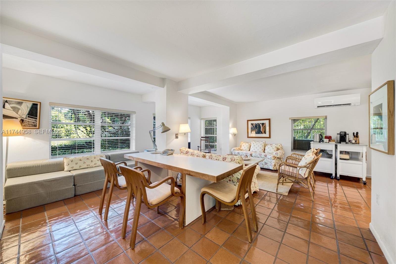 4197 Douglas Road Miami, FL 33133 - Photo 31 of 42 a view of a dining room with furniture window and outside view
