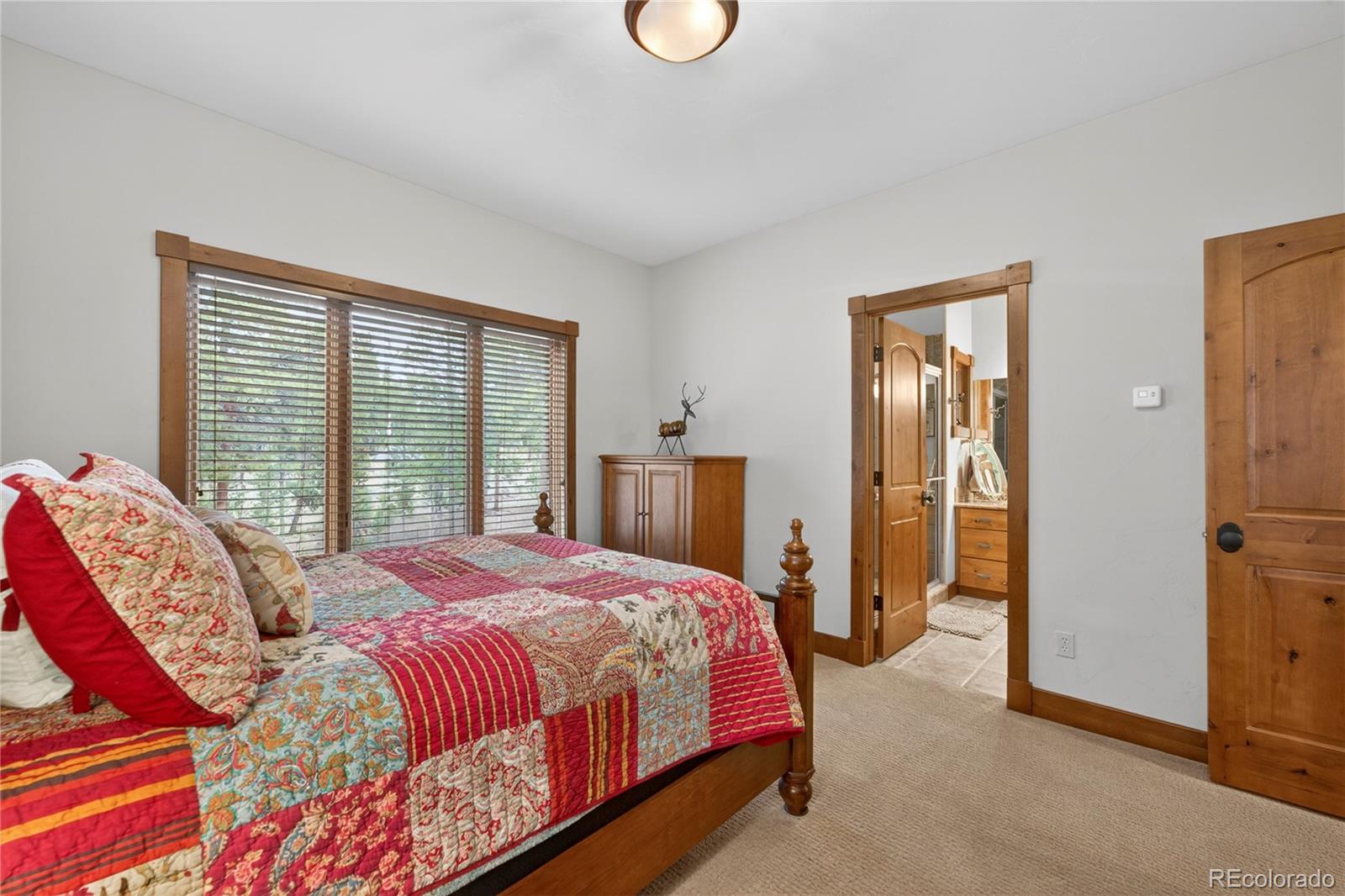 148 County Road Tabernash, CO 80478 - Photo 18 of 45 a bedroom with a bed and a window