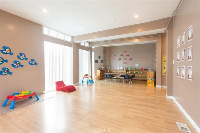 a view of a dining room with furniture and a chandelier
