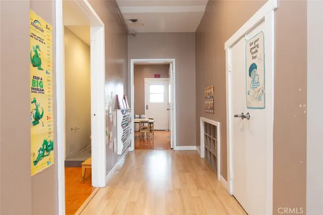 a view of a livingroom with workspace and a window