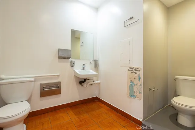 a room with table tennis flat screen tv and windows